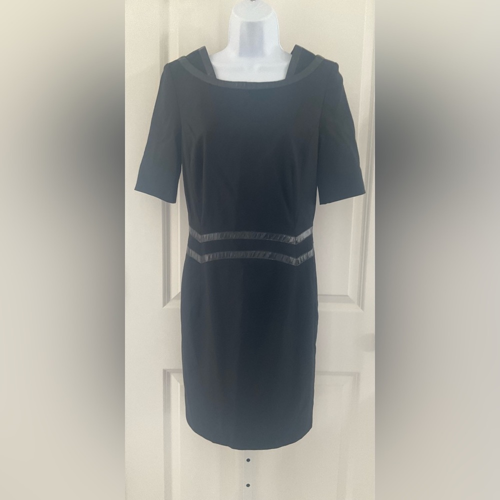 Escada Black Short Sleeve Patent Leather Stripe Sheath Dress.
Size 34(US 4).